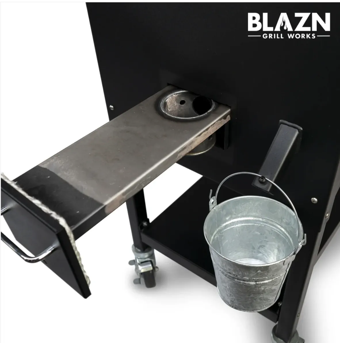 Blazn Grill Works Grand Slam Pellet Grill & Smoker, close-up of the pull-out ash cleanout and grease bucket