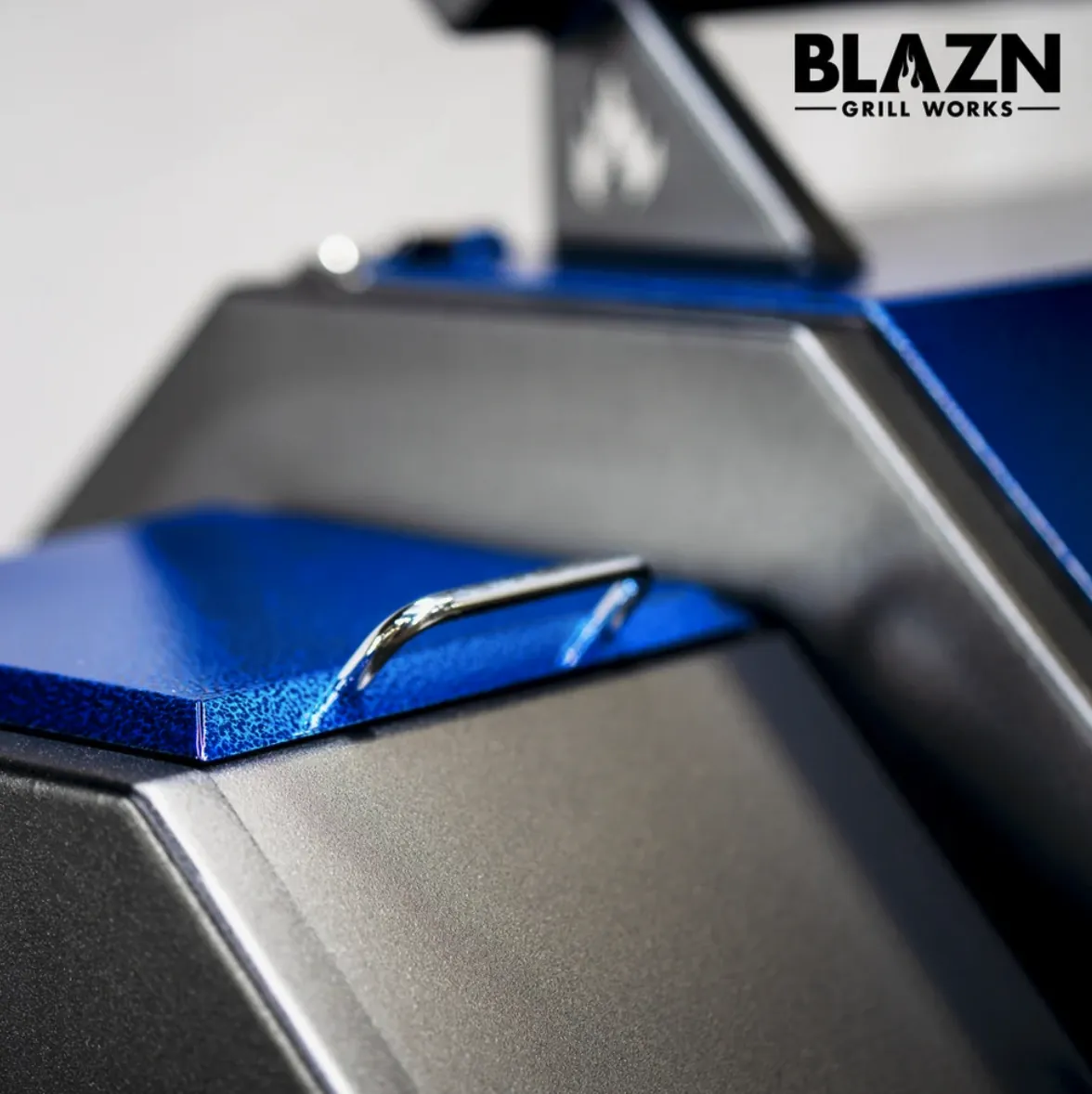 Blazn Grill Works Grid Iron Pellet Grill, close-up of the blue pellet hopper lid