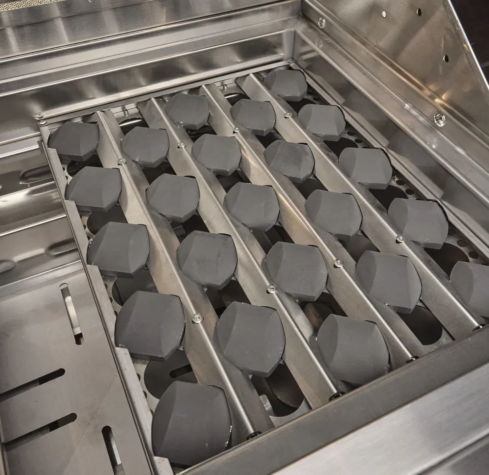 Coyote SL Series 30" Built-In Gas Grill with Sear Zone and Rotisserie, close-up of ceramic briquette tray