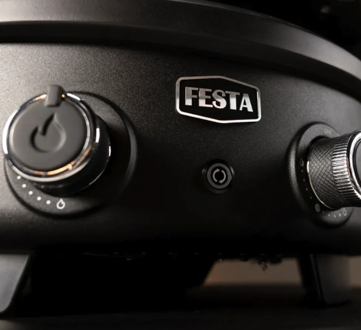 Festa Pizza Co Dual-Heat Rotating Pizza Oven, close-up of the dual-heat control knobs and Festa badge