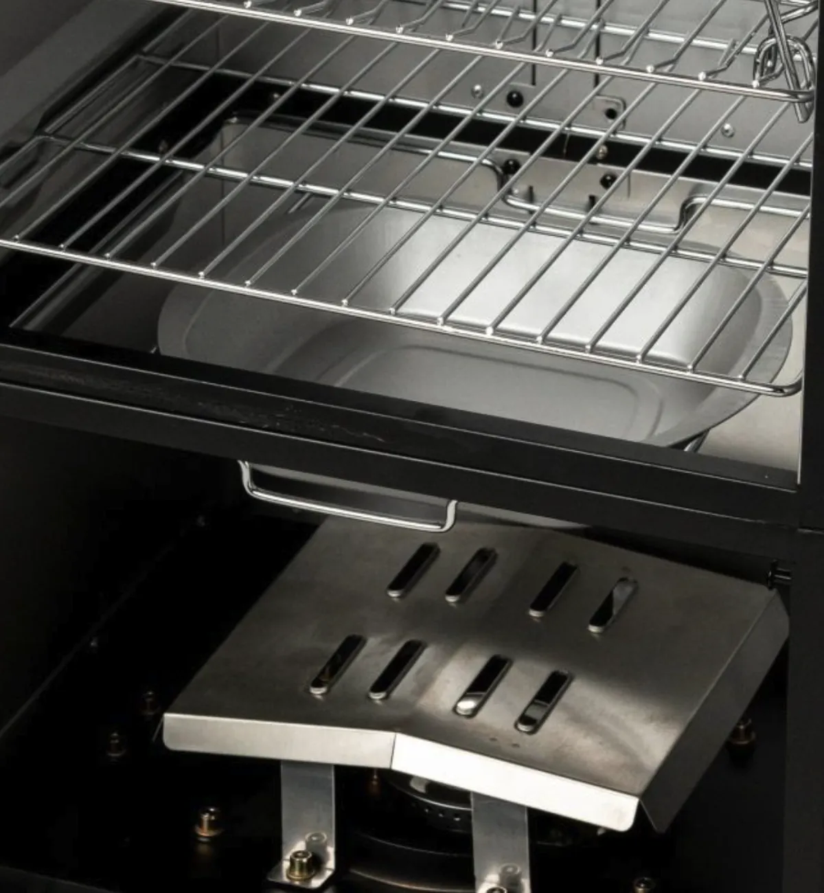 Masterbuilt 40" ThermoTemp XL Propane Smoker, close-up of the wood chip tray, water pan and burner cover