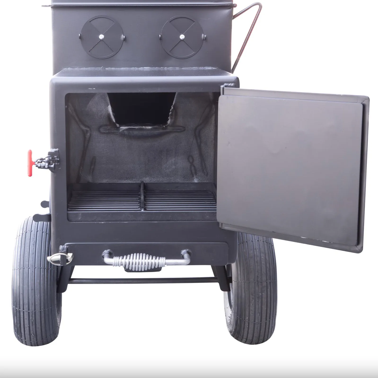 Front view of the Meadow Creek SQ36 smoker firebox with door open, showing interior grate and ash drawer.
