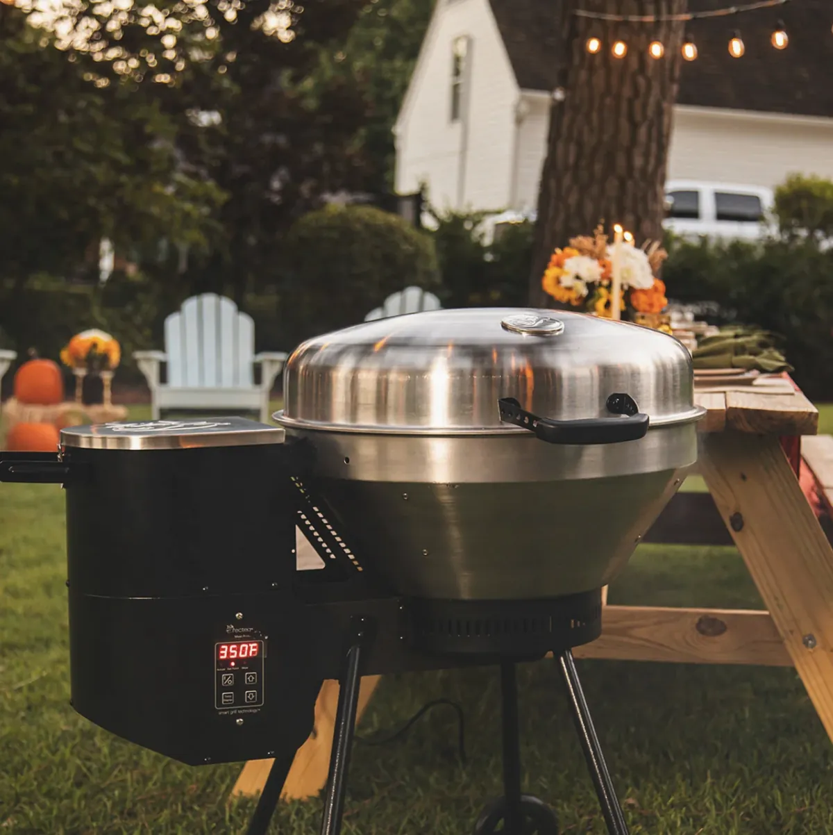 Recteq RT-B380 Bullseye Wood Pellet Grill, set to 350°F in a backyard with string lights