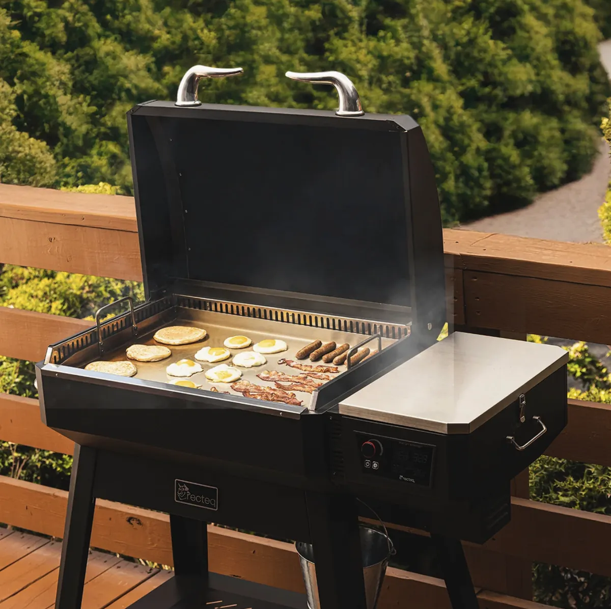 Recteq SmokeStone 480 Pellet Griddle, cooking pancakes, eggs, bacon and sausage on a deck