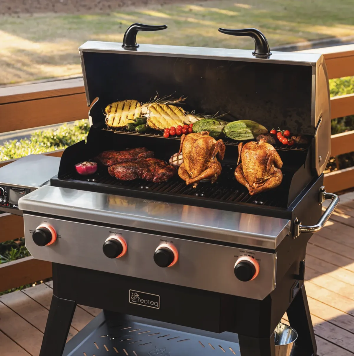 Recteq X-Fire Pro 825 Pellet Grill, cooking whole chickens, steaks, pineapple and vegetables on a deck
