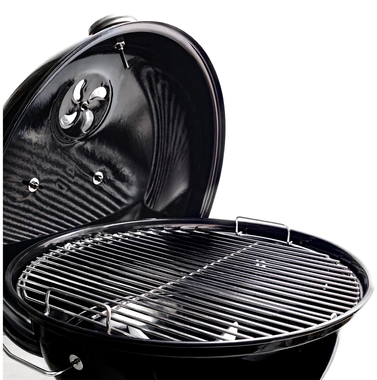 SnS Grills portable charcoal kettle with open black lid and stainless steel cooking grate