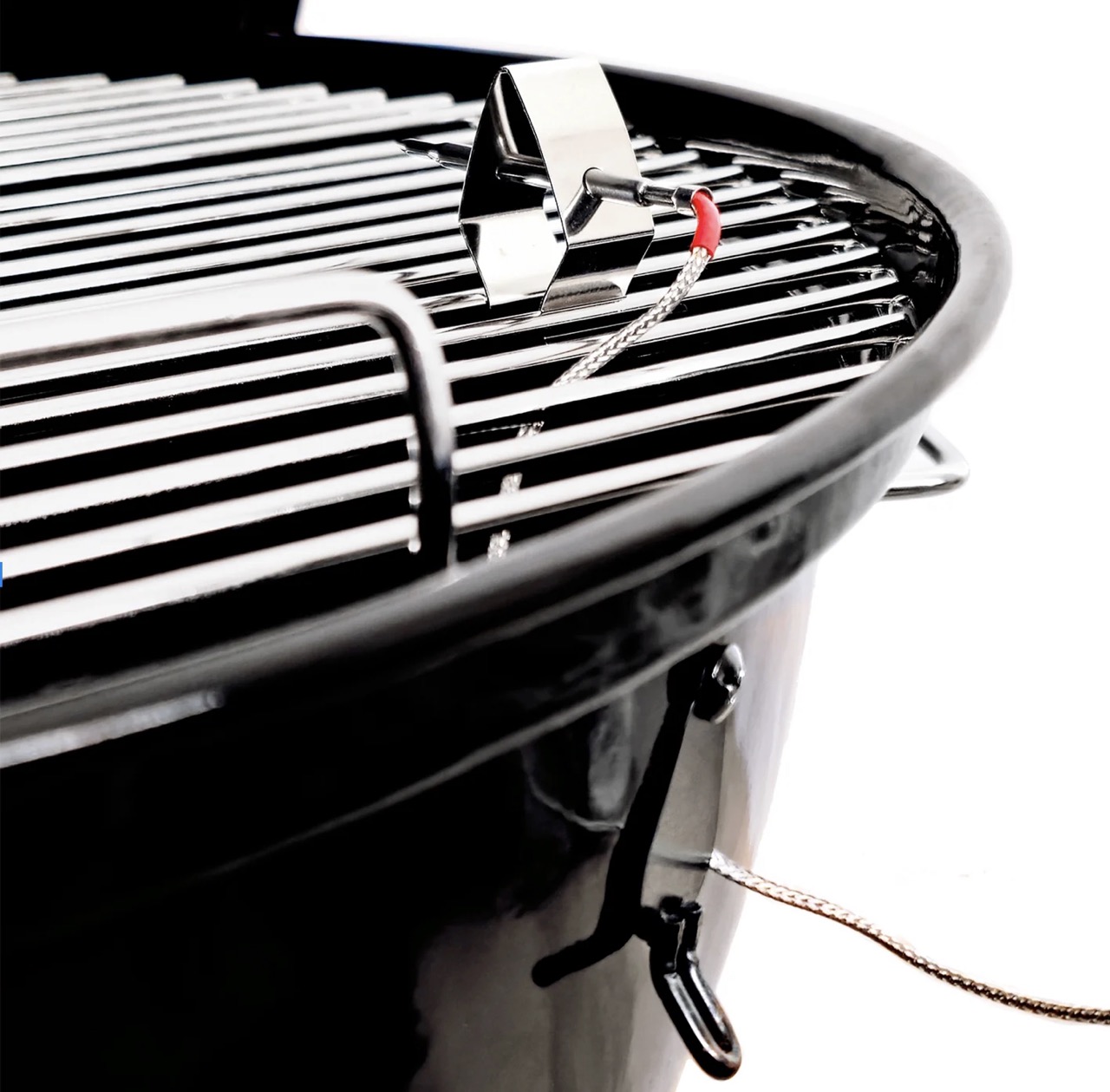 Close-up of temperature probe and stainless steel cooking grate inside SnS 18-inch charcoal kettle grill