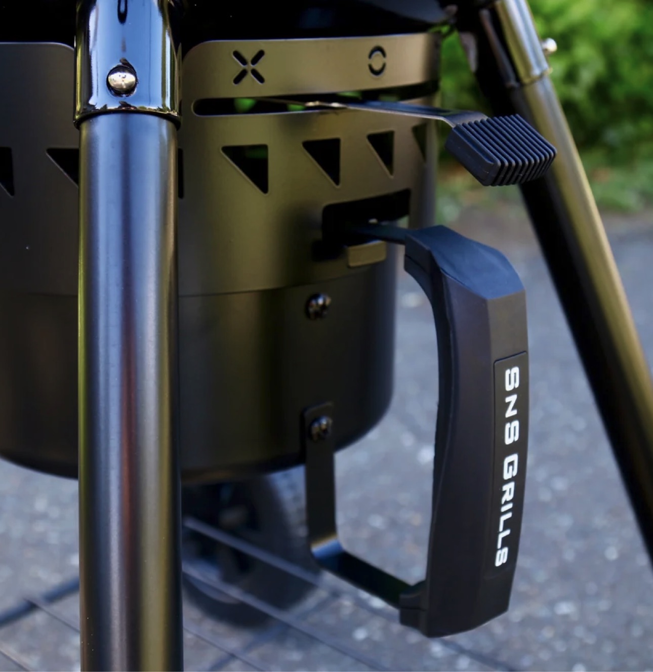 Close-up of the lower support and ash collection area of the SnS Slow 'N Sear kettle grill