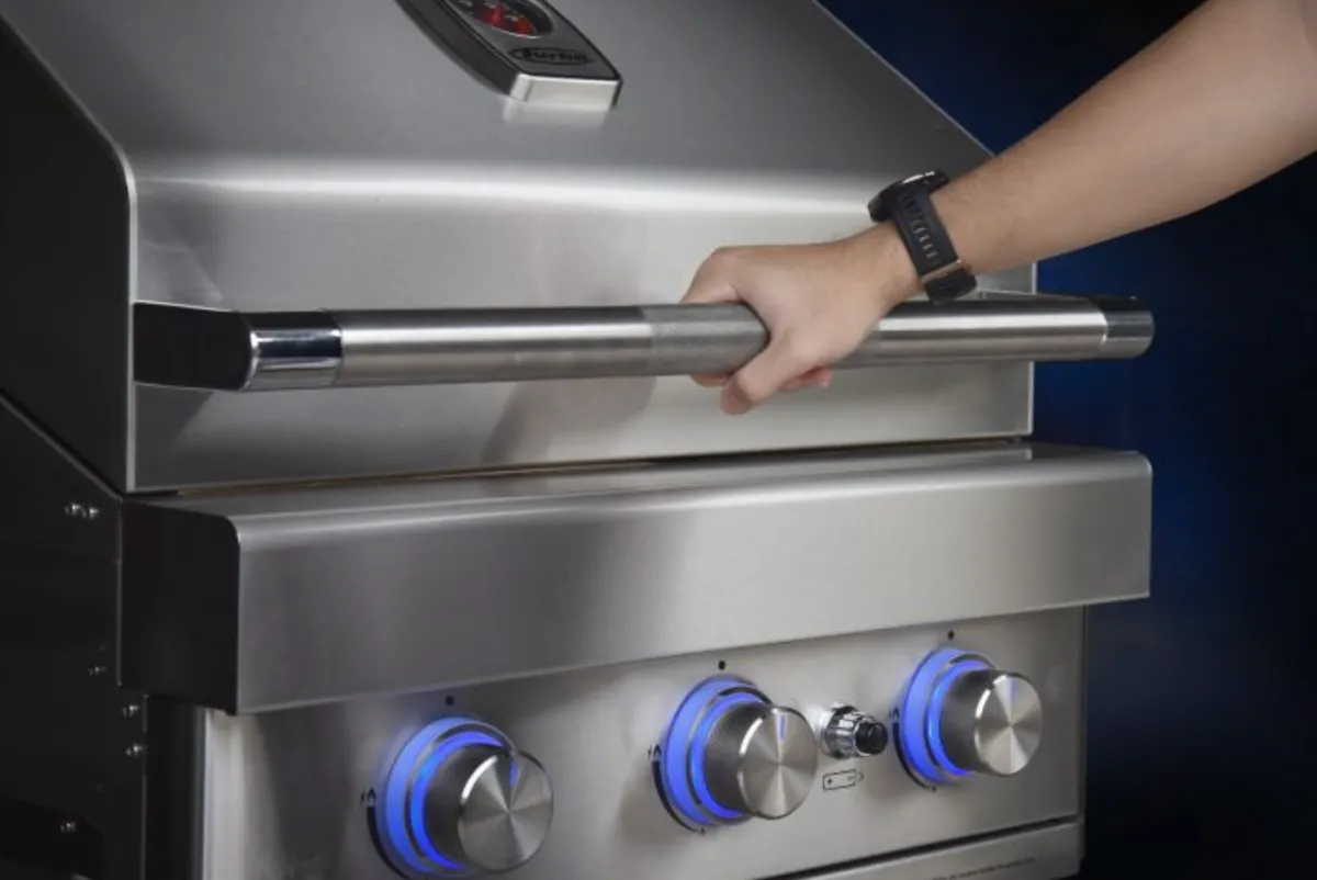Turbo 26" 3-Burner Built-In Gas Grill (Natural Gas), hand opening the lid by the stainless steel handle