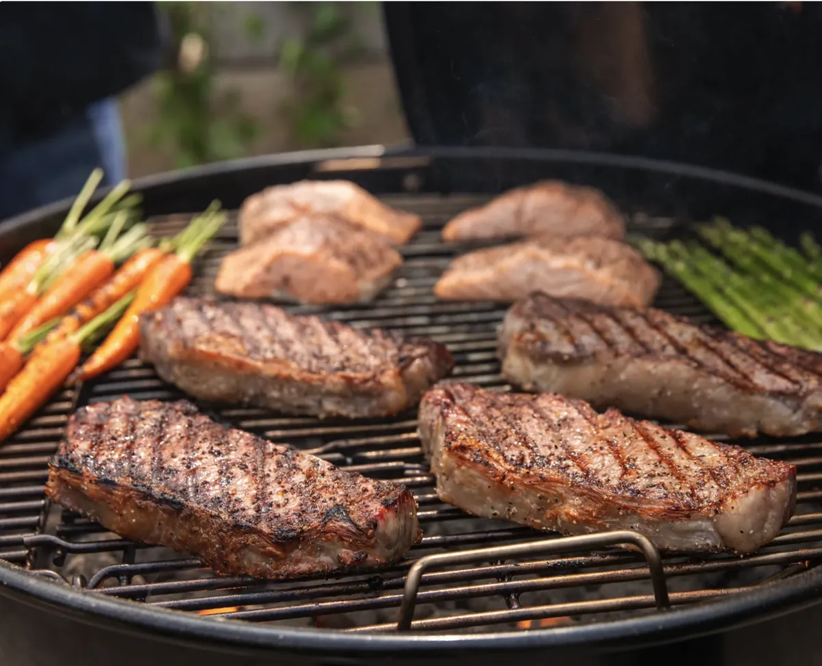 Weber Master-Touch 26" Charcoal Grill, grilling strip steaks, salmon, carrots and asparagus