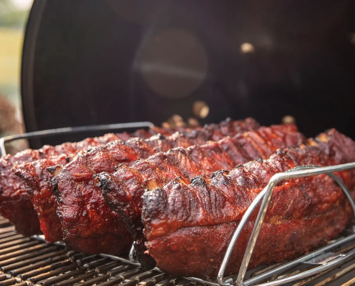 Weber Master-Touch 26" Charcoal Grill, smoking racks of ribs in a rib rack