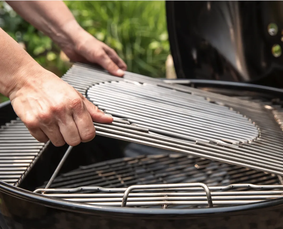 Weber Master-Touch 26" Charcoal Grill, lifting the hinged center insert of the cooking grate