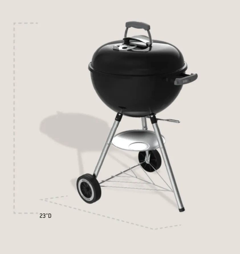 Weber Original Kettle 18" Charcoal Grill (Black), angled view with lid, ash catcher and wheels; 23 inches deep