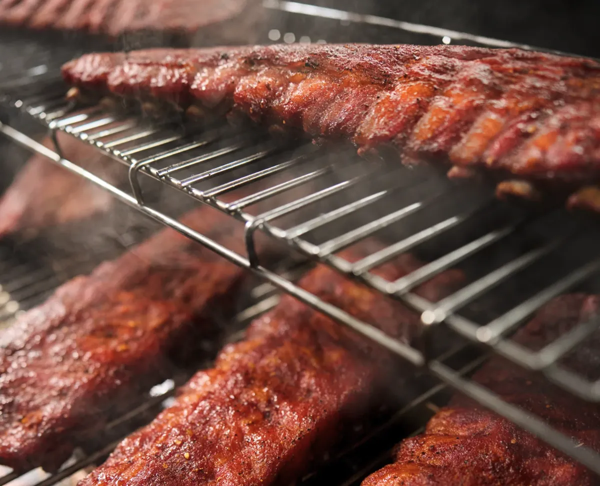 Weber Smoque Pellet Smoker, racks of smoked ribs on two levels