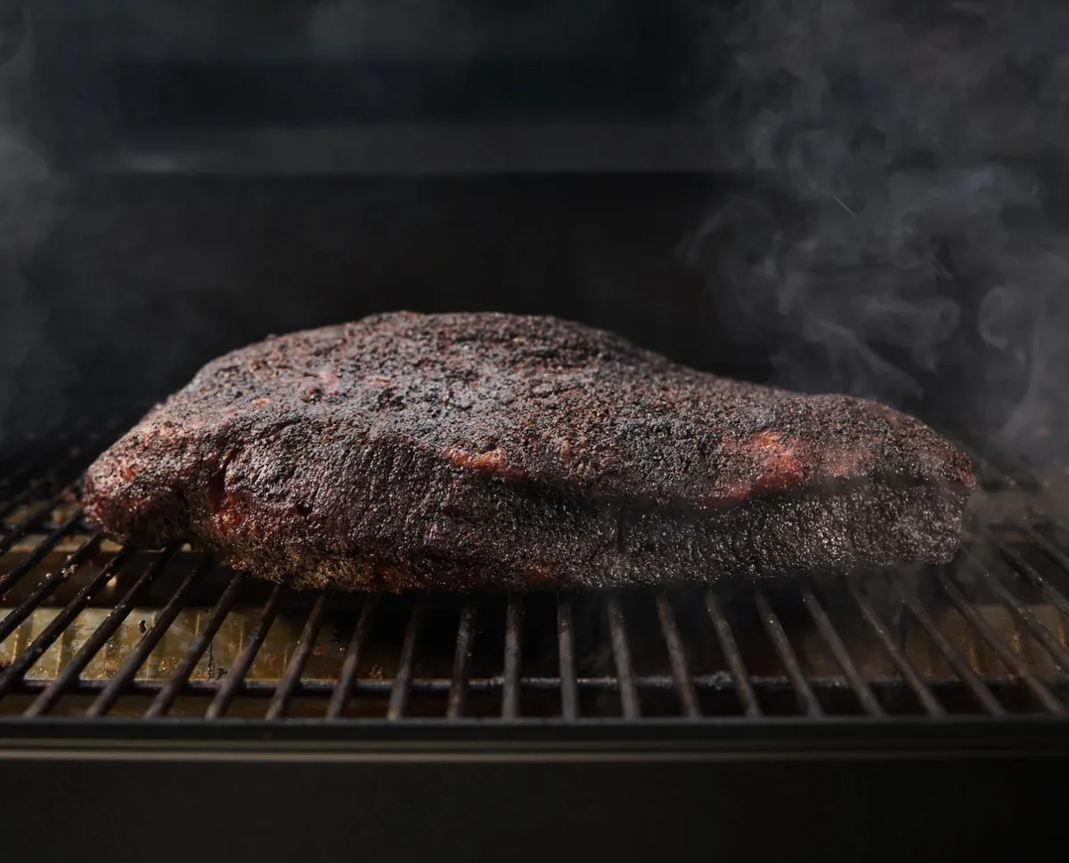 Weber Smoque XL Pellet Smoker, smoked brisket with dark bark on the grate