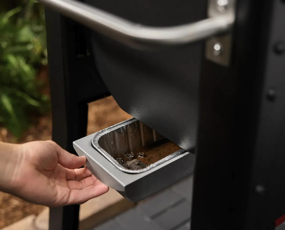 Weber Smoque XL Pellet Smoker, pulling out the grease tray with disposable liner